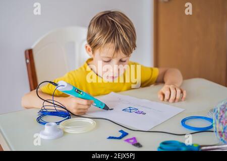 Kid using 3d printing drawing pen. Creative, leisure, technology education concept Stock Photo