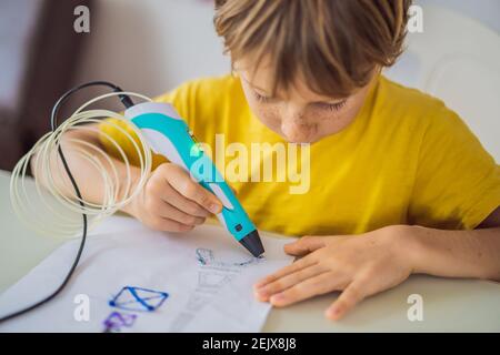Kid using 3d printing drawing pen. Creative, leisure, technology education concept Stock Photo