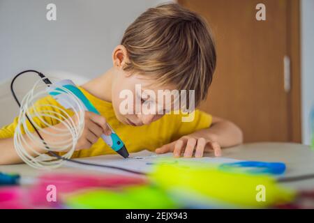 Kid using 3d printing drawing pen. Creative, leisure, technology education concept Stock Photo