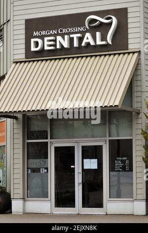 29 March 2020 - Surrey, B.C., Canada - Signs are seen in the window of a closed Dental clinic location, during the COVID-19 pandemic. Photo by Adrian Brown/Sipa USA
