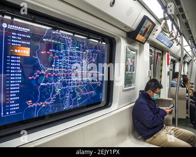 A window at a train of line 6 of Beijing metro system becomes a digital ...