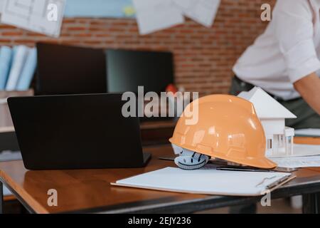 safety helmets  on the table at site construction. Architecture, engineering, business and civil concept. Stock Photo
