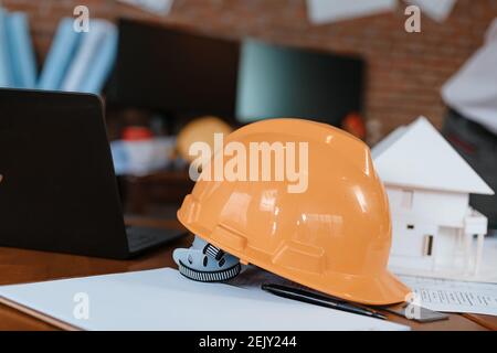 safety helmets  on the table at site construction. Architecture, engineering, business and civil concept. Stock Photo