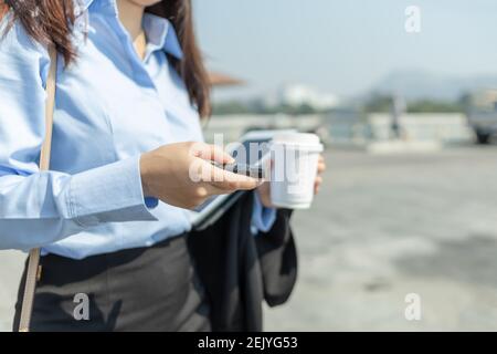 hand pressing button remote to lock or unlock a car. Stock Photo