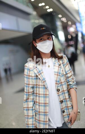 Chinese actress Yan Zhichao arrives at a Chengdu airport before ...