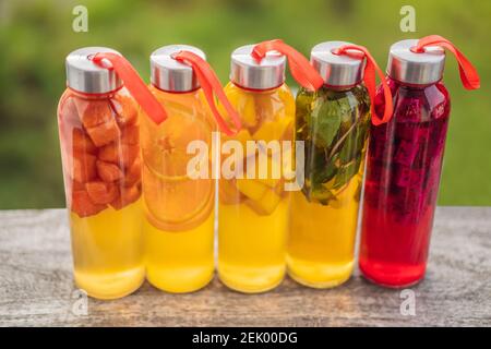 Cambucha with various fruits arranged in the form of a rainbow. Homemade fermented raw kombucha tea with different flavorings. Healthy natural Stock Photo