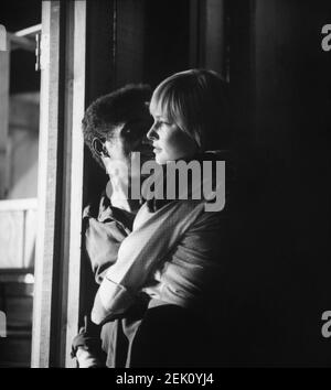 SAMMY DAVIS Jr and His Wife MAY BRITT on set candid during break in filming of SERGEANTS 3 / SERGEANTS THREE 1962 director JOHN STURGES Essex Productions / Meadway-Claude Productions Company / United Artists Stock Photo