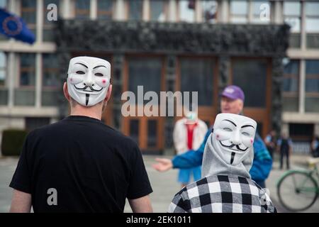  Protesters wearing Guy Fawkes masks on the back of their head during the demonstration. Around five hundred people protested in front of Slovenian parliament building against the government and its alleged corruption amid the coronavirus measures and restrictions. (Photo by Luka Dakskobler / SOPA Images/Sipa USA) 