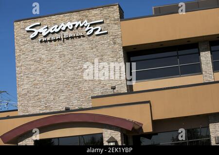 A logo sign outside of a Seasons 52 restaurant location in King of ...