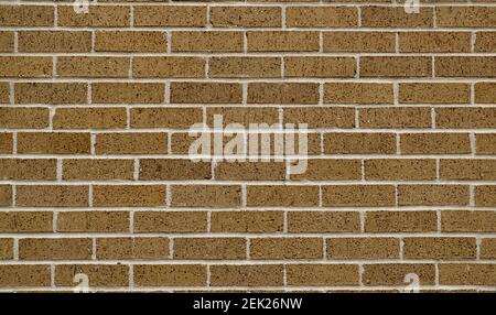 Brown brick surrounding wall section, color swatch sample. Plain earth tones full frame image. Stock Photo