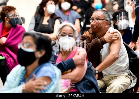 (210223) -- ECATEPEC, Feb. 23, 2021 (Xinhua) -- Citizens inoculated with COVID-19 vaccines developed by Chinese pharmaceutical company Sinovac sit in an observation area at a vaccination site in Ecatepec, Mexico, Feb. 22, 2021. Mexican health authorities on Monday began to vaccinate older adults with a COVID-19 vaccine developed by Chinese pharmaceutical company Sinovac, after a shipment of doses arrived on Saturday. Mexico's government designated the first shipment of the Sinovac vaccine to arrive in Ecatepec, a city in central State of Mexico that lies on the outskirts of the capital Mexi Stock Photo