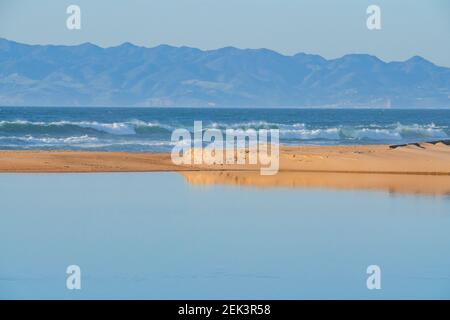 Guadalupe river, Pacific ocean, sandy beach, and mountains on background, beautiful California Central Coast Stock Photo