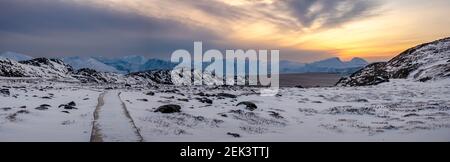 panoramic view of the walking path to unesco world heritage Ilulissat Icefjord at sunset in Greenland Stock Photo