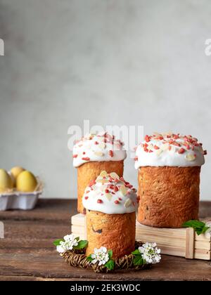 homemade Easter cake and colored eggs on wooden rustic table Stock Photo