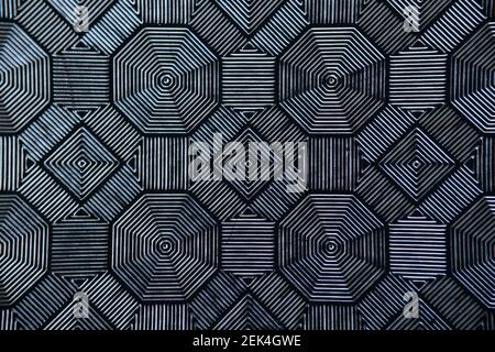 Black patterned tiles in form of rhombuses closeup Stock Photo