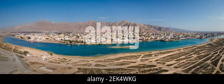 Panoramic view of Al Rams county, the suburb of Ras Al Khaimah emirate in the United Arab Emirates settling bellow the sandstone mountains by the seas Stock Photo