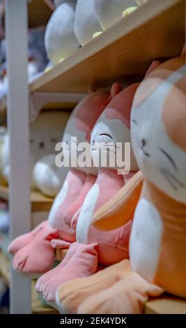 Moscow, Russia - March 8, 2020: plush toys, cats on a shop counter in a shopping center. Stock Photo