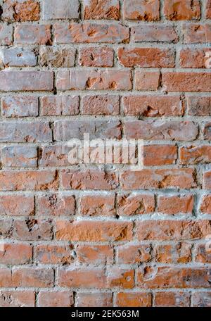 Old red brick wall. Vertical background, loft interior. Stock Photo