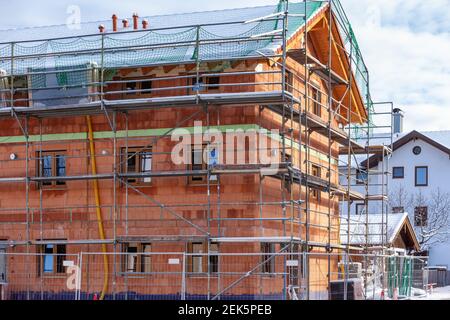 House in shell with fencing in winter Stock Photo