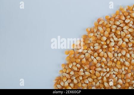 Heap of raw popcorn grains texture background Stock Photo