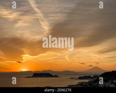 Sunset and the brilliantly beautiful sky over the ocean near Mt. Fuji shows the passage of time just before darkness Stock Photo