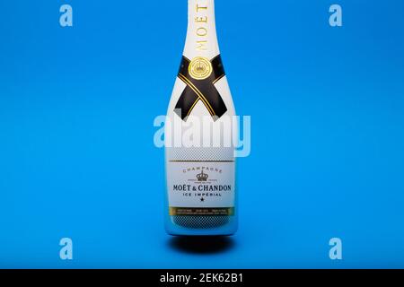 Prague,Czech Republic - 23 February 2021: Bottle of Moet and Chandon Champagne on the blue background. Moet and Chandon is one of the worlds largest c Stock Photo