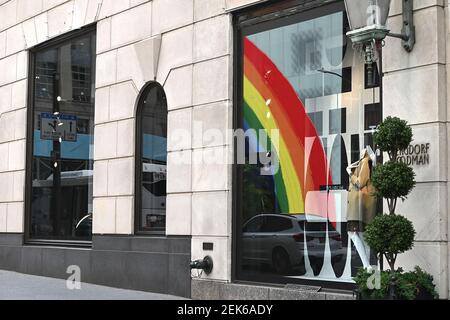 A reflection in Bergdorf Goodman window of the newly opened (curbsidee  pickup only) Louis Vuitton 5th Ave. flagship store, decorated with a large  rainbow in honor of “Pride Month”, New York, NY, on June 18, 2020. After  nearly three months of 