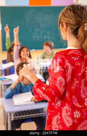 Teaching children in a school classroom Stock Photo