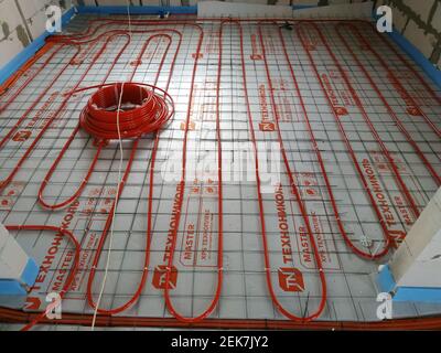 Kaluga, October 10, 2019 Russia: installation of underfloor heating from central heating.new Stock Photo