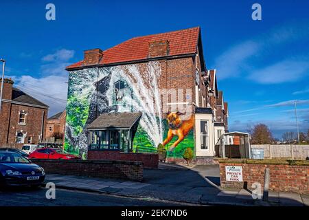 A new mural by artist Paul Curtis, painted on the side of the Parkside Veterinary Surgery in New Ferry, Wirral. Picture date: Tuesday February 23, 2021. Stock Photo