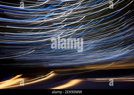 abstract light streaks background pattern against black  Stock Photo