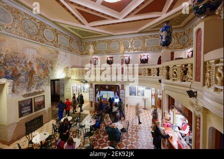 People in the foyer of Aurora cinema, one of the oldest cinema of St. Petersburg, Russia. The cinema was opened in 1913 as Piccadilly cinema Stock Photo