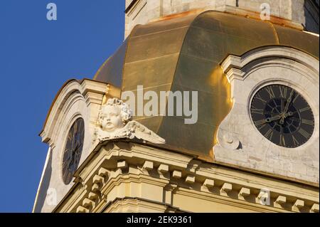 Head of angel between the tower clocks on the belfry of St. Peter and Paul Cathedral in St. Petersburg, Russia Stock Photo