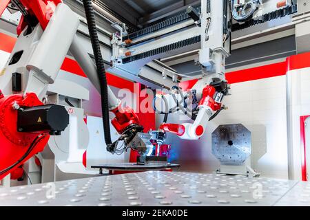 Automatic robotic equipment welding metal in factory Stock Photo