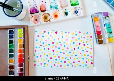 Colorful watercolor abstract dots pattern on white paper background Stock Photo