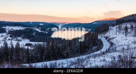 Panorama of Titisee lake in Southern Black Forest Nature Park at dusk Stock Photo