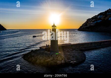 Spain, Balearic Islands, Andratx, Helicopter view of Port D Andratx Lighthouse at sunset Stock Photo