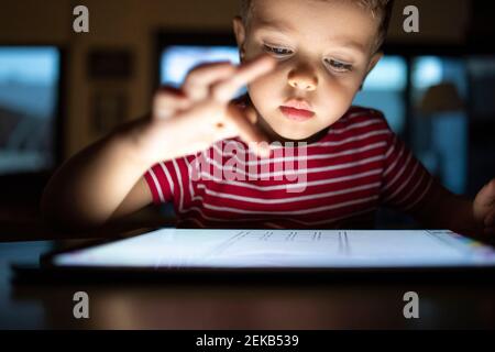 Cute boy using digital tablet at home Stock Photo
