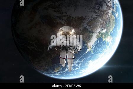 Astronaut orbiting planet Earth in outer space. Solar system. 3D render Stock Photo