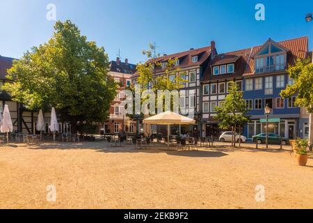 Germany, Lower Saxony, Brunswick, Historic half timbered houses surrounding empty square in Magniviertel quarter Stock Photo