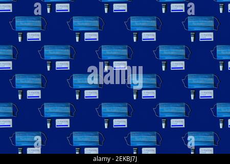 Pattern of protective face masks against blue background Stock Photo