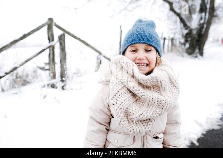 Smiling girl wearing warm clothing during winter Stock Photo