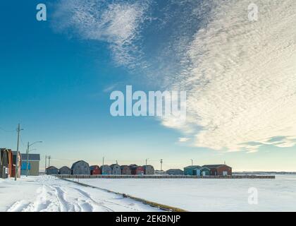 Commercial fishery buildings on the wharf during winter in rural Prince Edward Island, Canada. Stock Photo