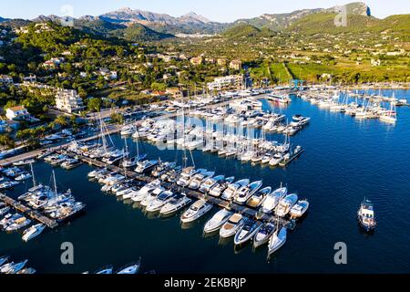 Spain, Balearic Islands, Andratx, Helicopter view of boats moored in harbor of coastal town Stock Photo