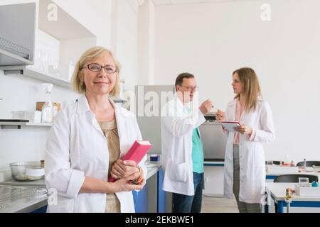 Portrait of a researcher in white coat in a lab Stock Photo