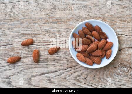 salty baked almond seed batch on cup Stock Photo