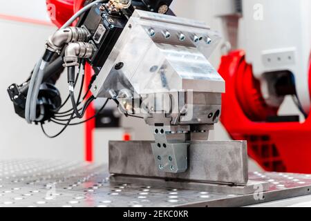 Close-up of automatic industrial welding robot in factory Stock Photo