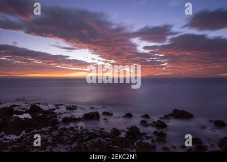 Clouds above sea at sunset Stock Photo