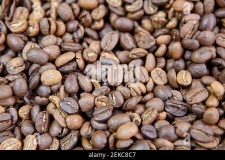 Texture of pile of roasted coffee beans. Stock Photo
