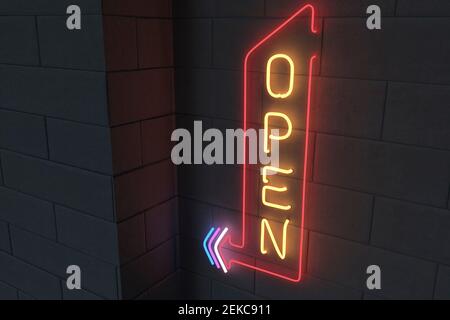 Illuminated open sign on black brick wall Stock Photo